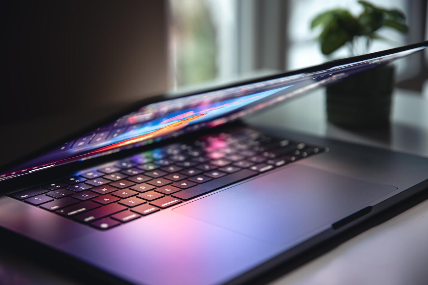 close-up-laptop-keyboard-colorful-neon-illumination-backlit-keyboard_169016-29227