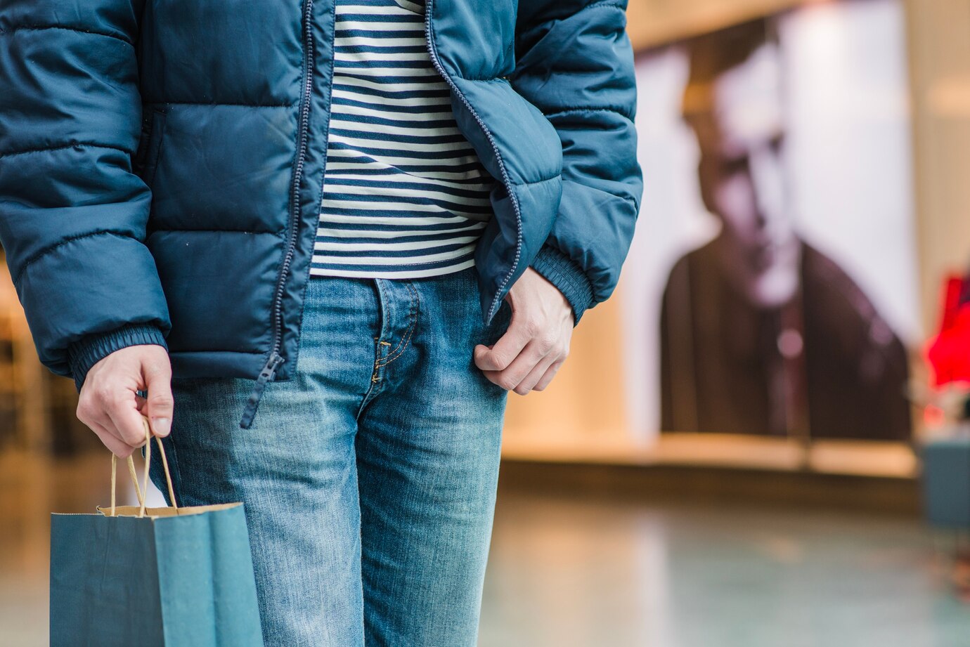 man-coat-standing-holding-bag_23-2147652275